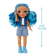 Pink sneakers and tiny purse complete Sapphire's denim look