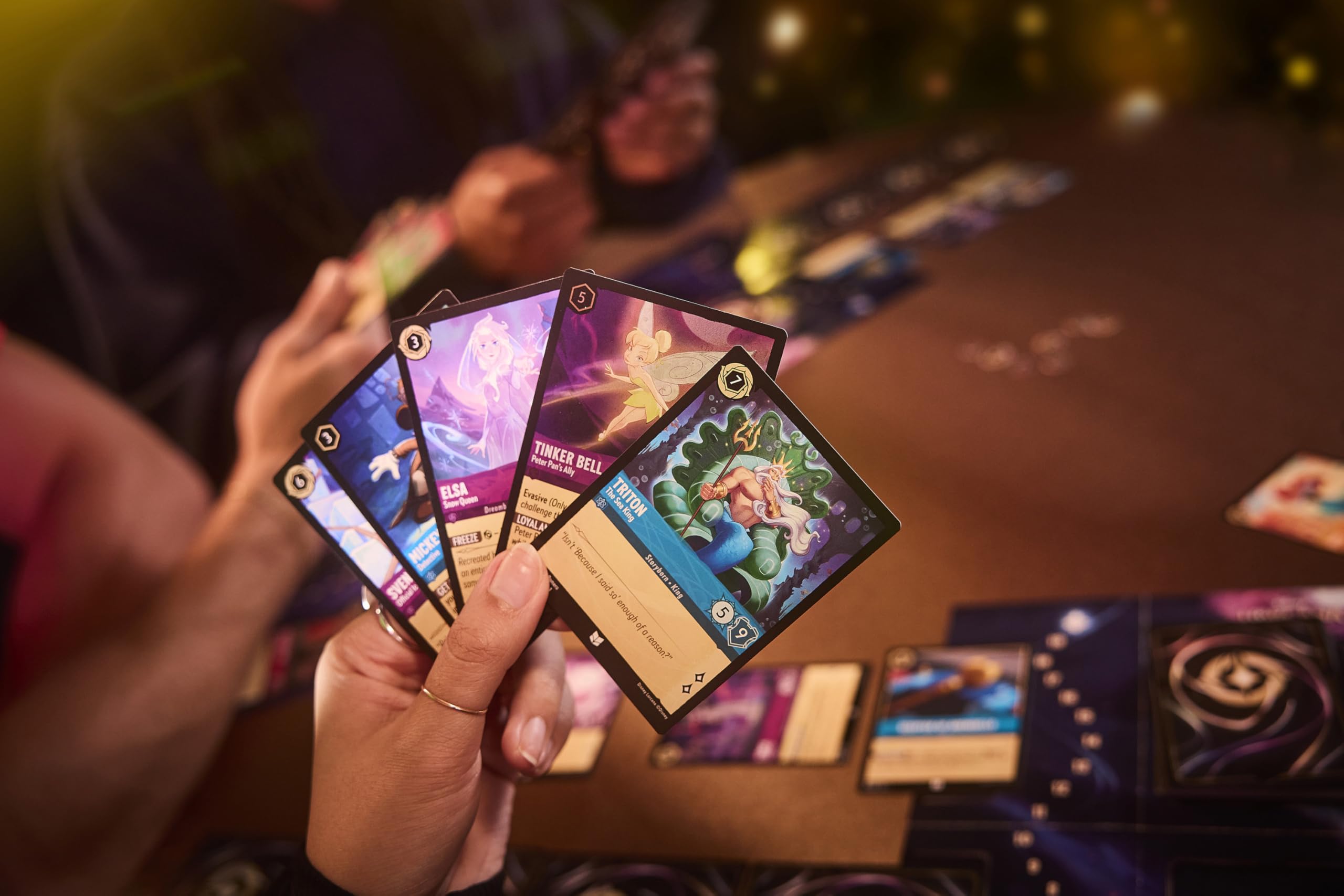 View of booster pack contents for Ravensburger Lorcana Rise of the Floodborn