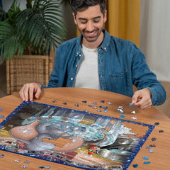 Ravensburger Dumbo puzzle close-up of iconic ears in vibrant colors.