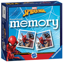Child's hands arrange Ravensburger memory cards into pairs to practice memory.