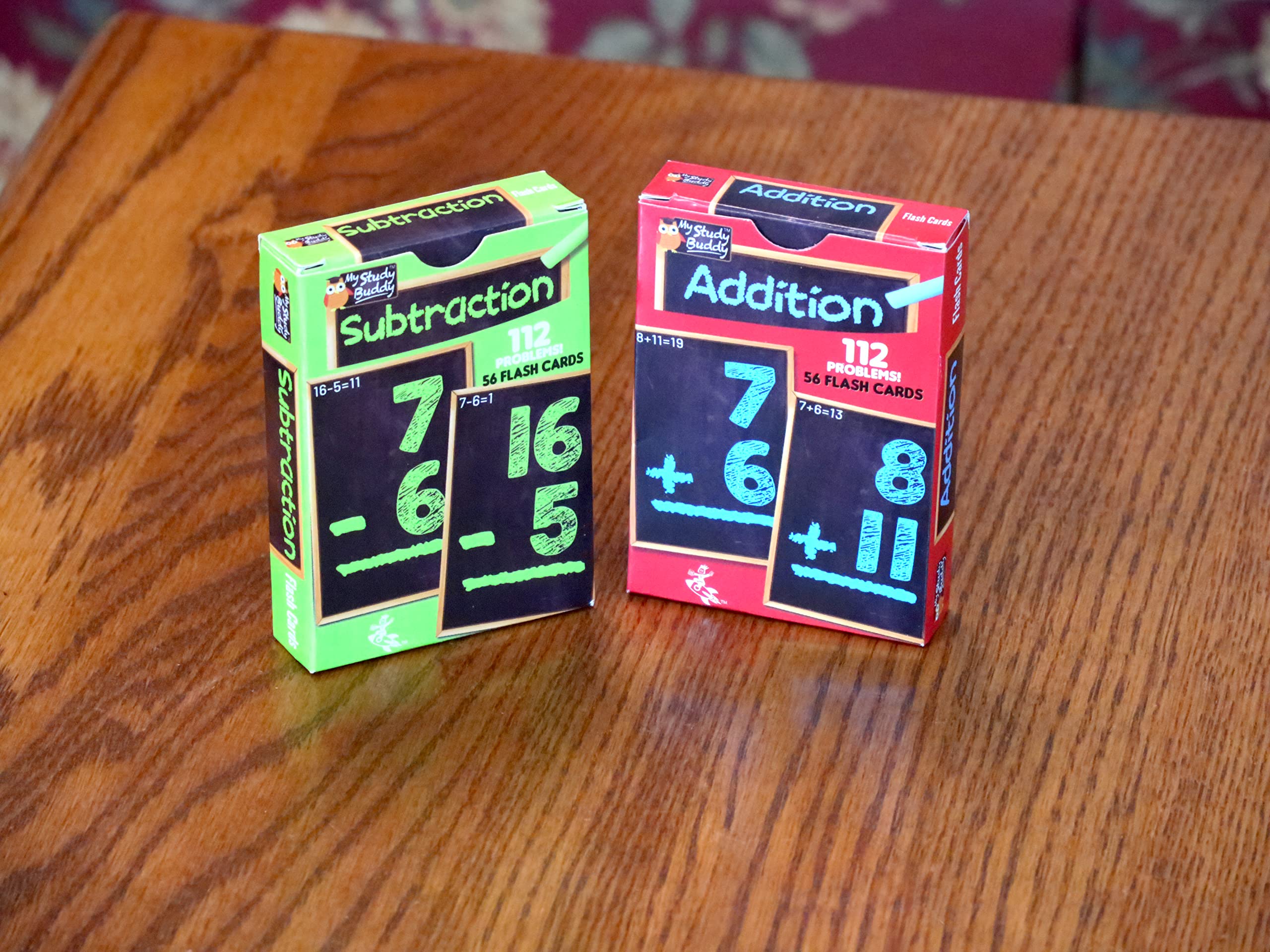 Regal Games kids practicing math outdoors with colorful cards