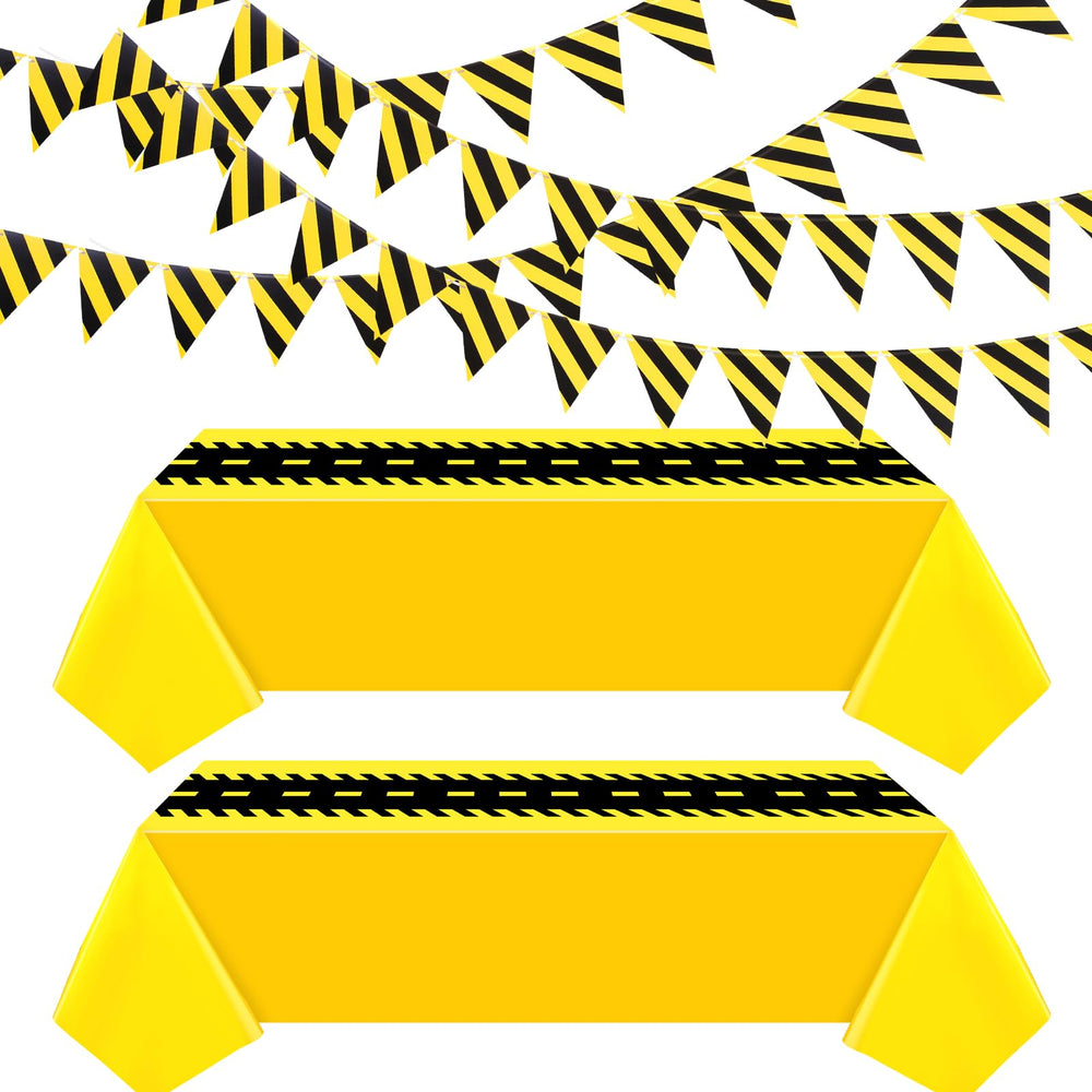 Remagr construction tablecloth 54x108 inch in black and yellow protects tables during parties.