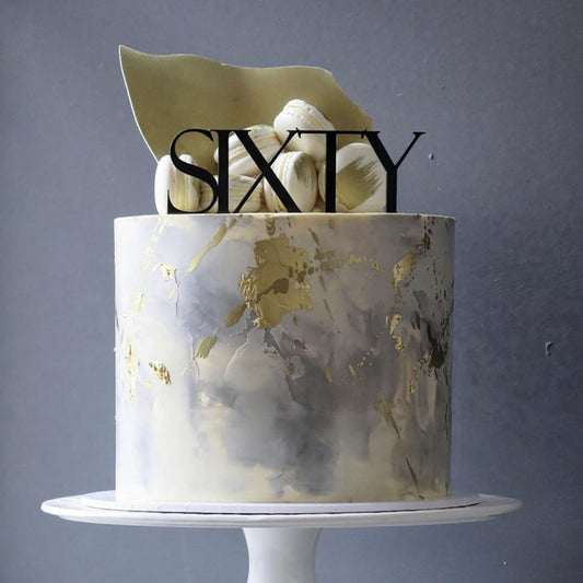 Remax acrylic Sixty topper on cake, creates elegant centerpiece for milestone birthday