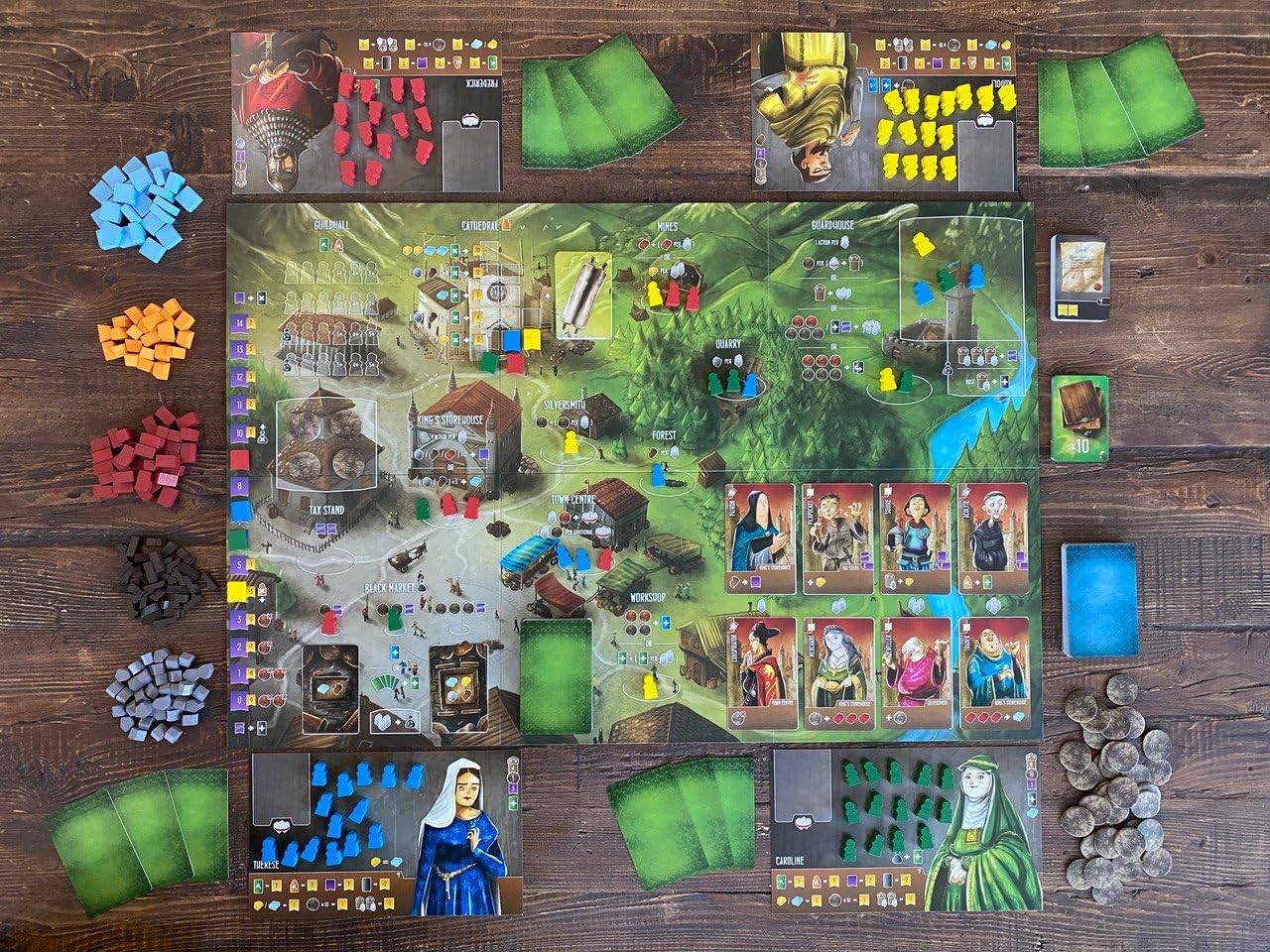 Renegade Game Studios workers on the board, showcasing resource management in action.