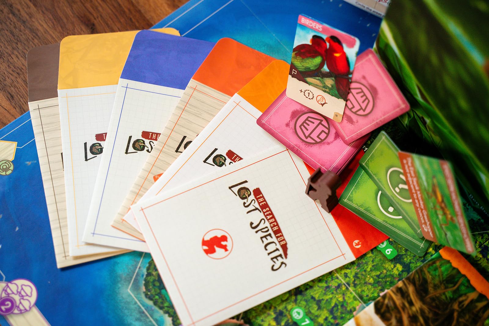 Renegade Game Studios The Search for Lost Species note sheets—record clues and eco-focused observations.