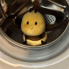 RHHSSE Bee plush as a bedtime companion on a cozy nightstand.