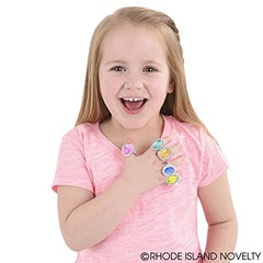 Rhode Island Novelty plastic jewel rings on a child’s hand—sparkle for costumes and rewards.