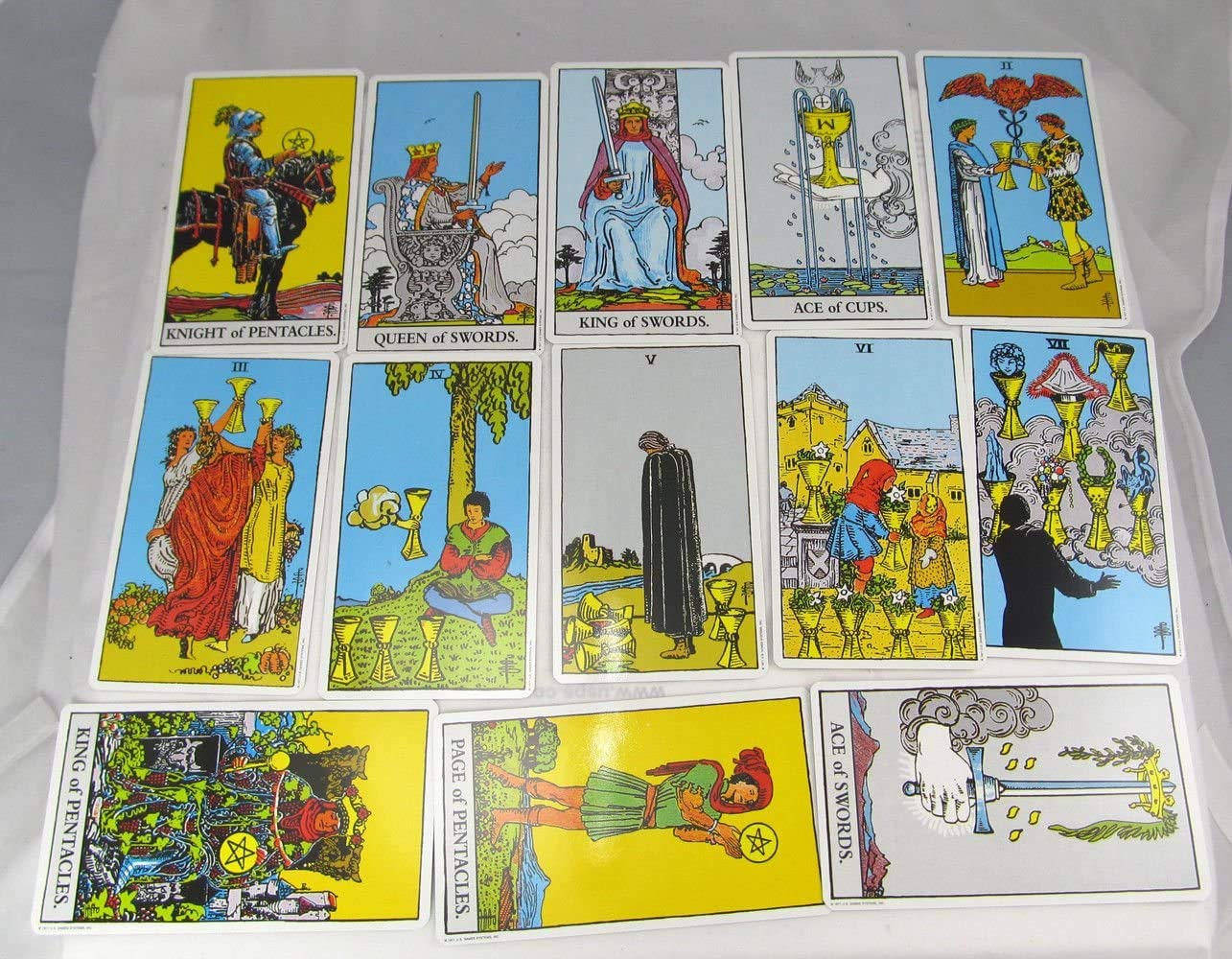 Rider-Waite deck illustrations feature vivid layouts for symbolism.