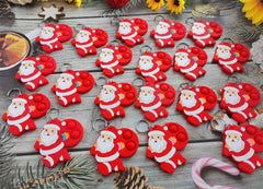 Roaqua colorful Santa Claus pop fidget demonstrating party favor use.