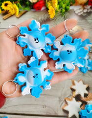 Roaqua winter snowflake mini pop keychain close-up shows vibrant colors
