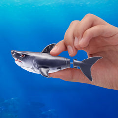 Shark emerging from a tub for screen-free pretend play and pranks