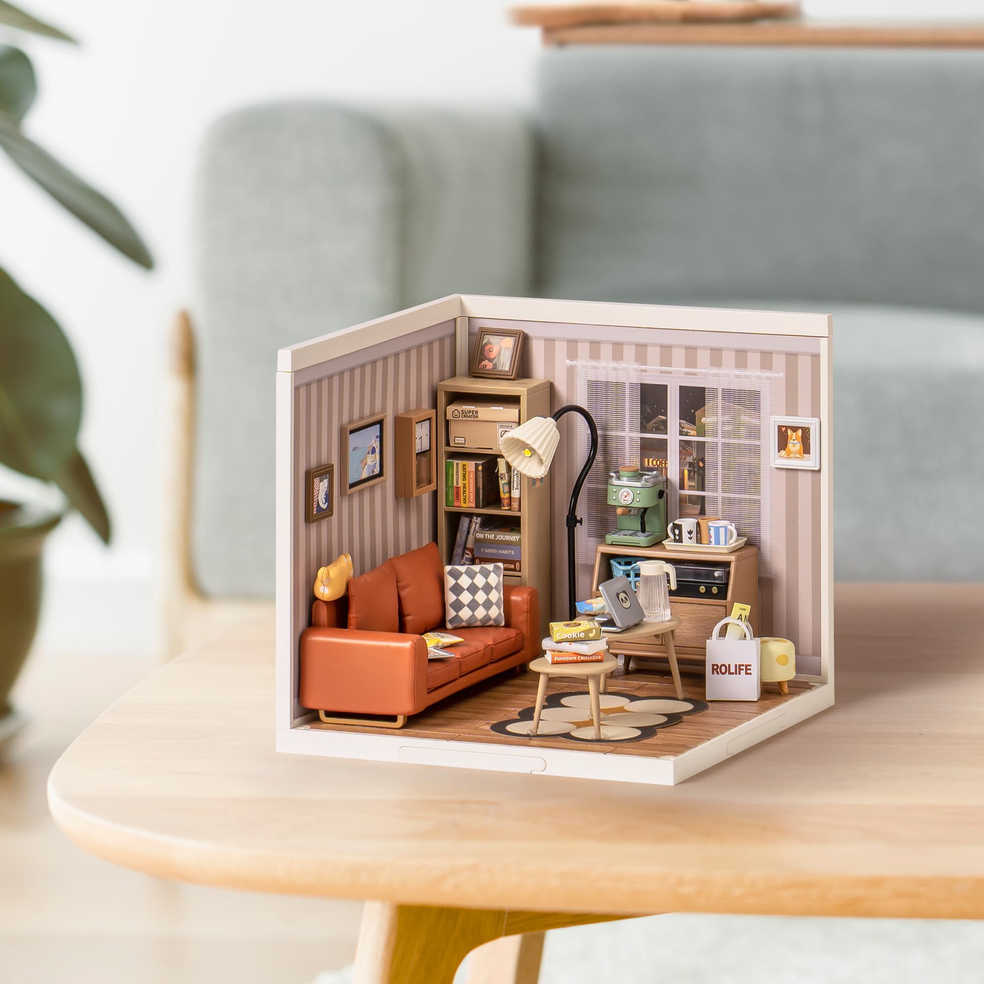 ROBOTIME Compact desk display diorama offers a charming workspace vignette.