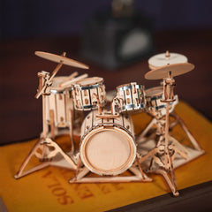 Robotime drum kit assembly in progress, boosting patience and fine motor skills