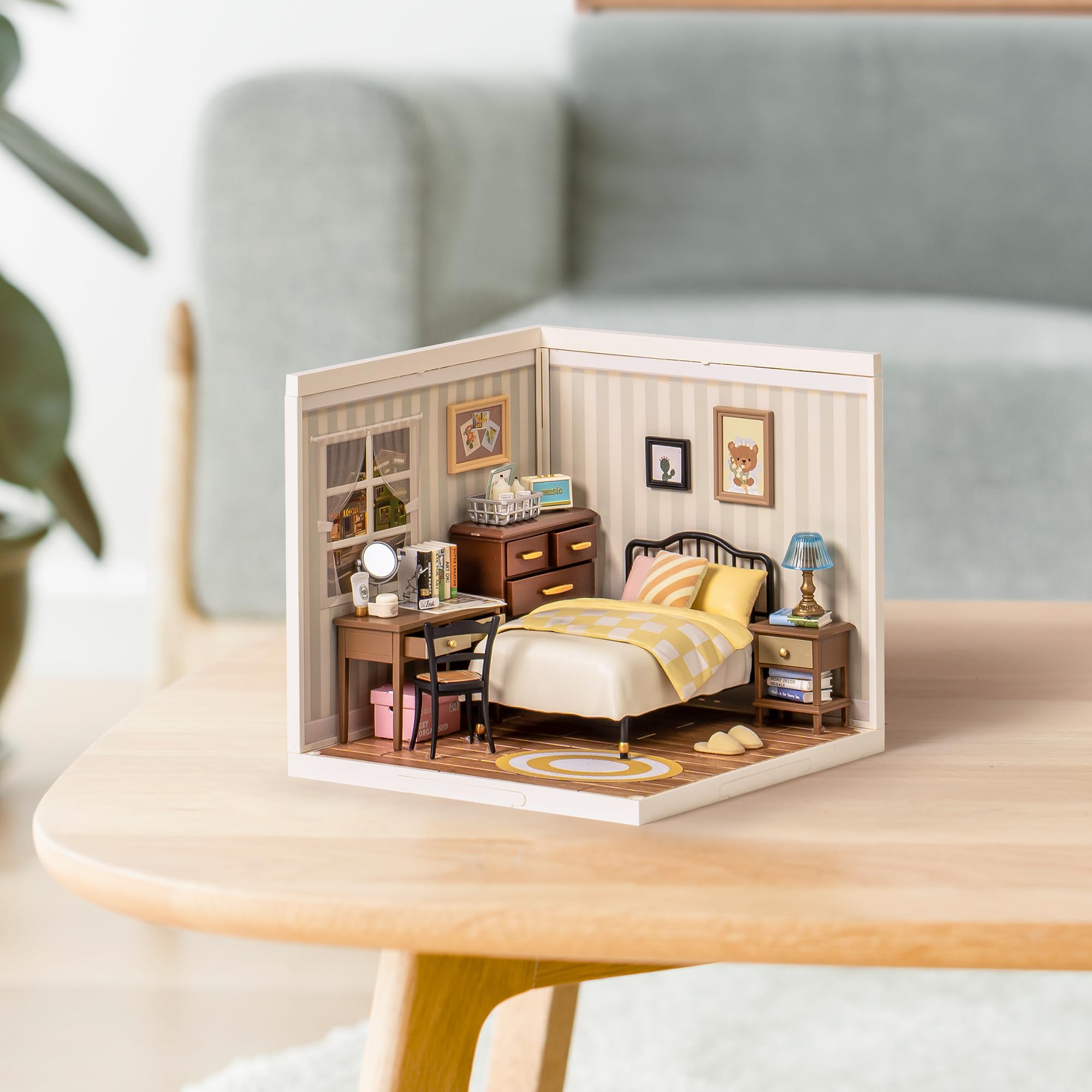 Robotime Sweet Dream Bedroom nightstand with drawers adds storage and charm.
