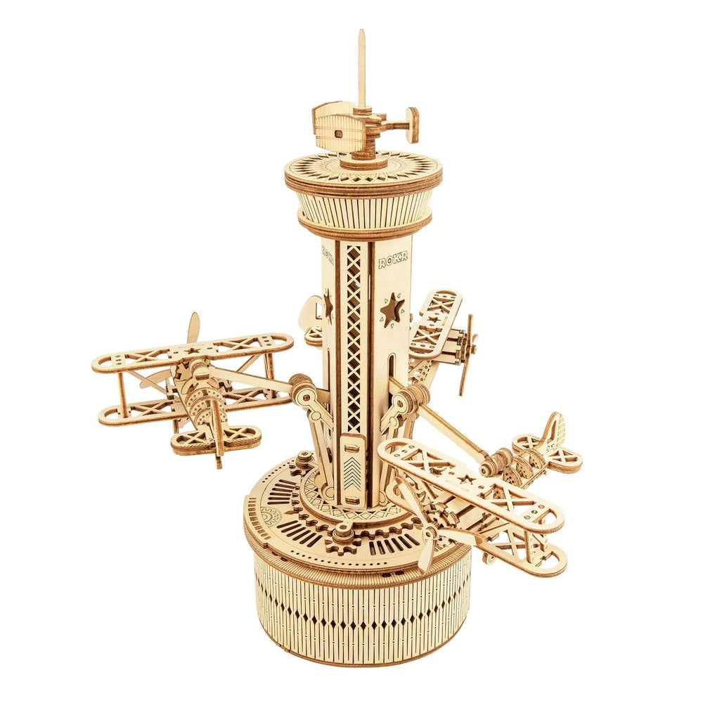 ROKR airplane tower music box assembly shows interlocking wooden pieces for a satisfying build