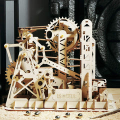 ROKR Lift Coaster marble travels along the wooden track with gears visible
