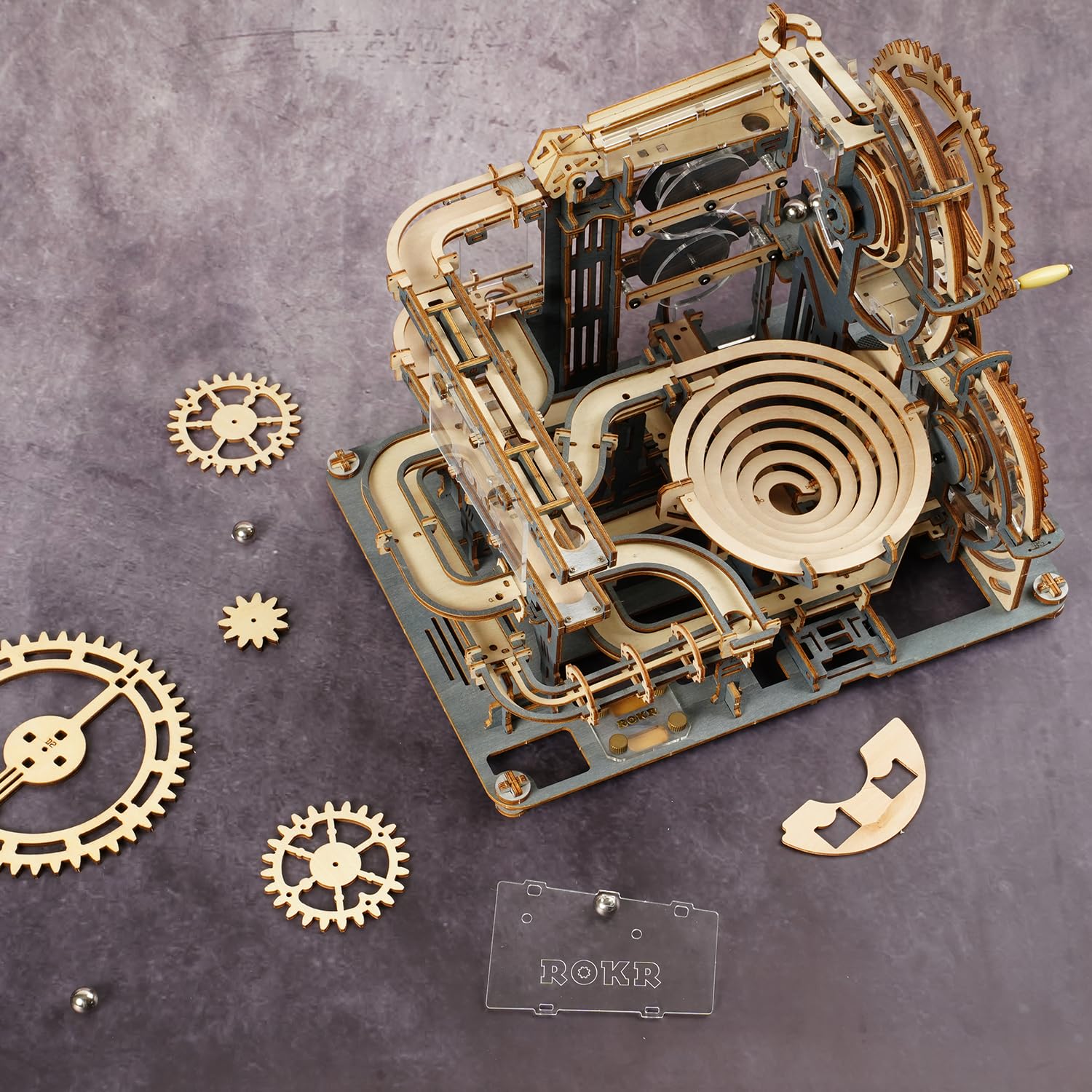 ROKR marble run assembly with crank and gears showing smooth marble movement