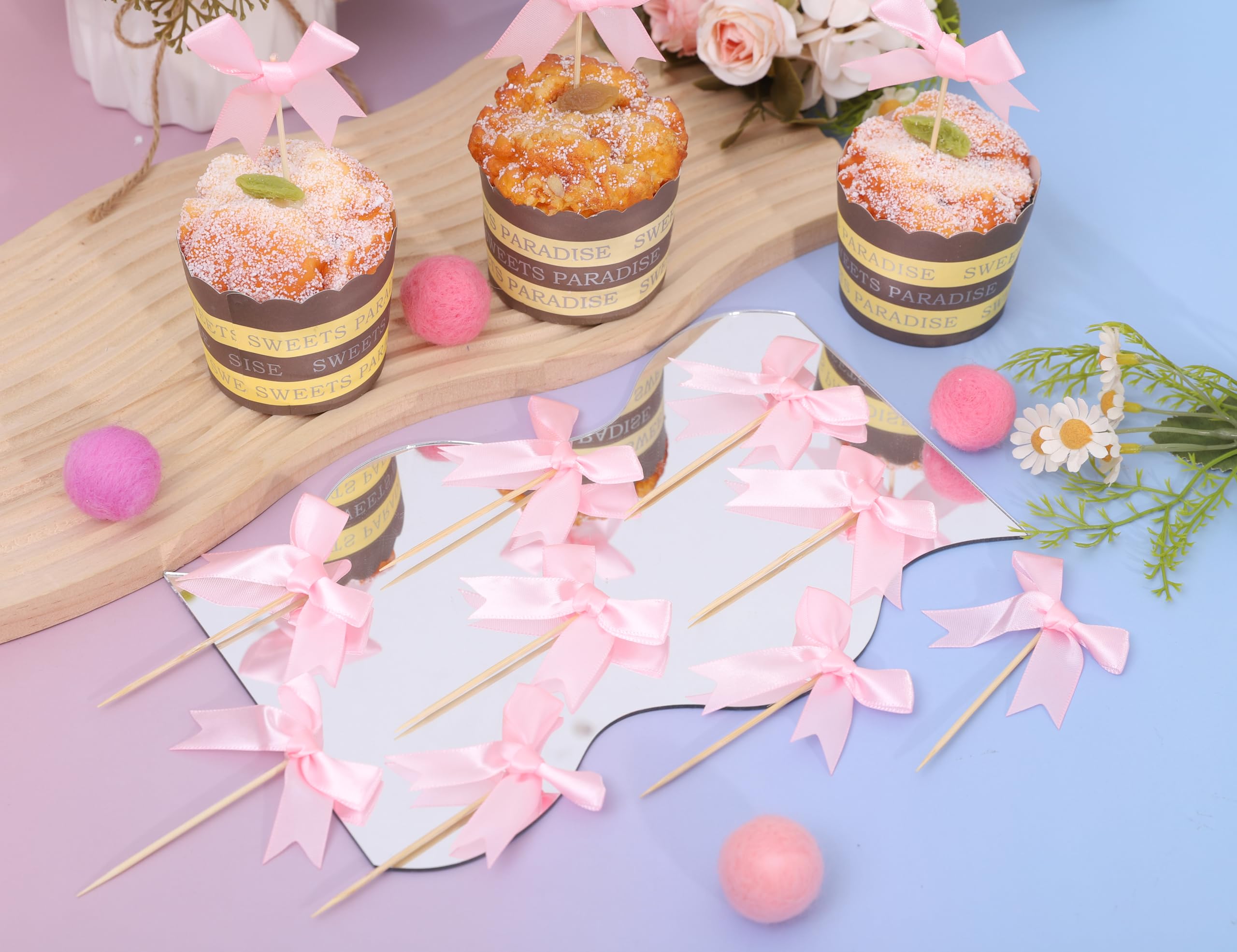 Rweseo Coquette Pink Bow Baby Shower display atop cupcakes.