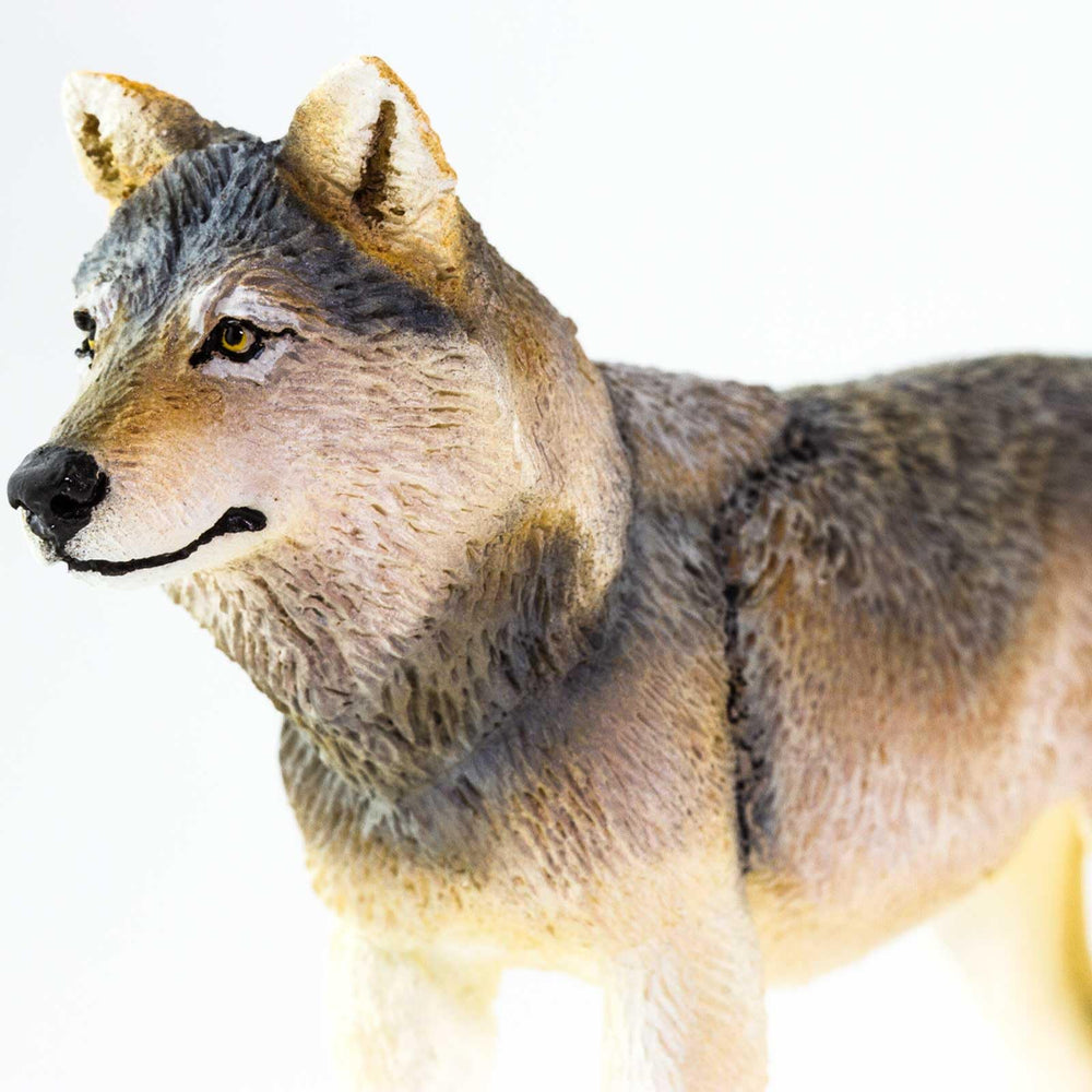 Safari Ltd. Gray Wolf Figurine with ruler-scale shows 4-inch size for reference.