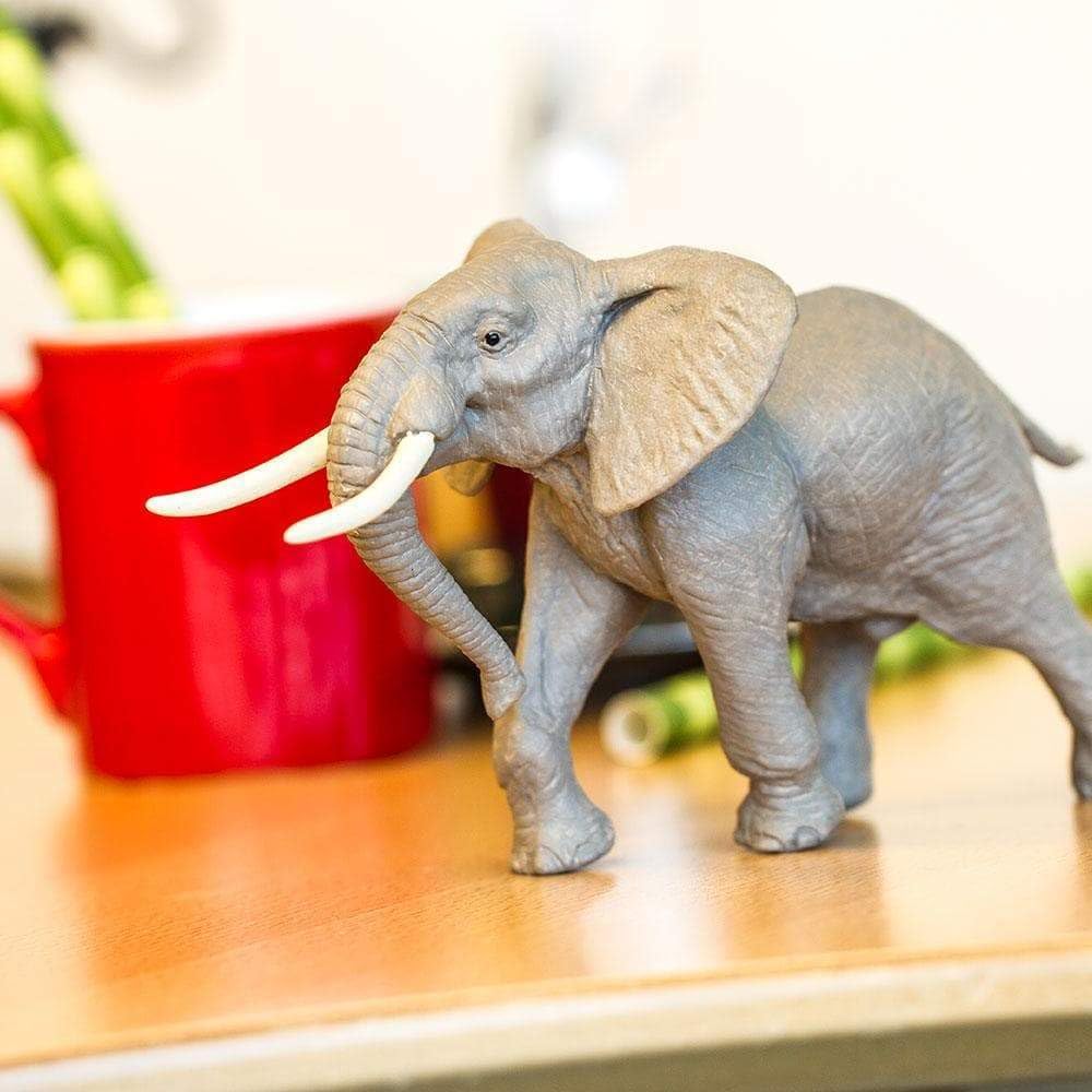 Safari Ltd 7.4-inch elephant figurine with realistic texture for lifelike display.