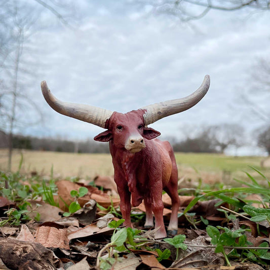 Safari Ltd Watusi Bull figurine shows realistic reddish-brown body for lifelike storytelling.