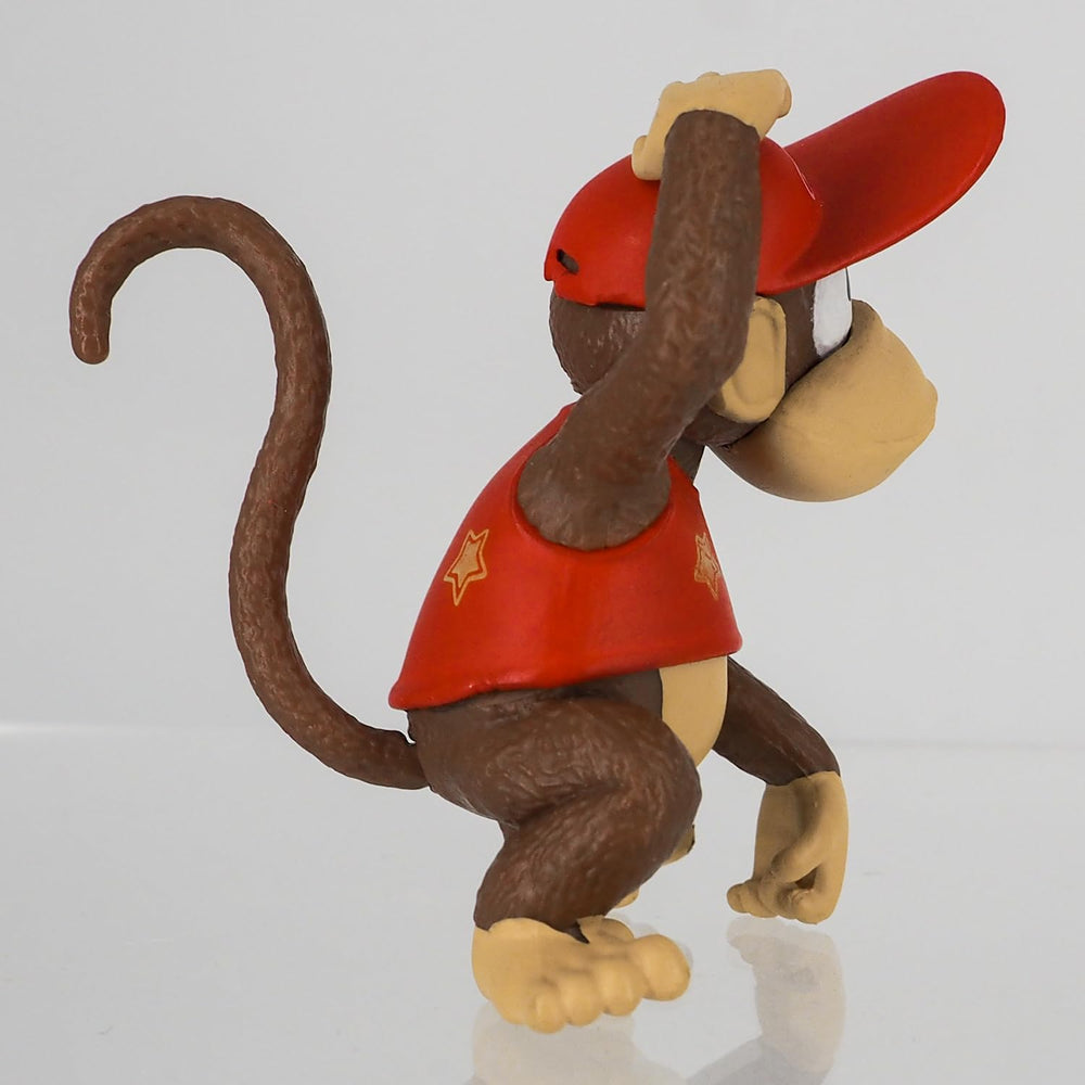 Sanei FCM-032 Diddy Kong on desk display with other collectibles.