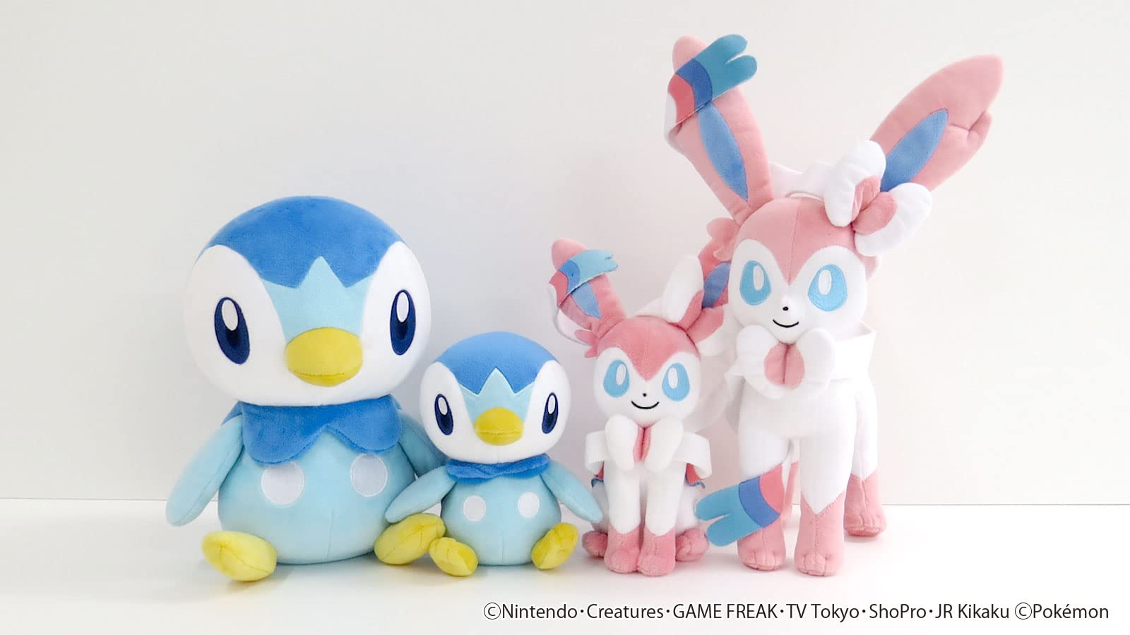 Sanei Piplup plush features flipper arms and yellow feet for poseable display.