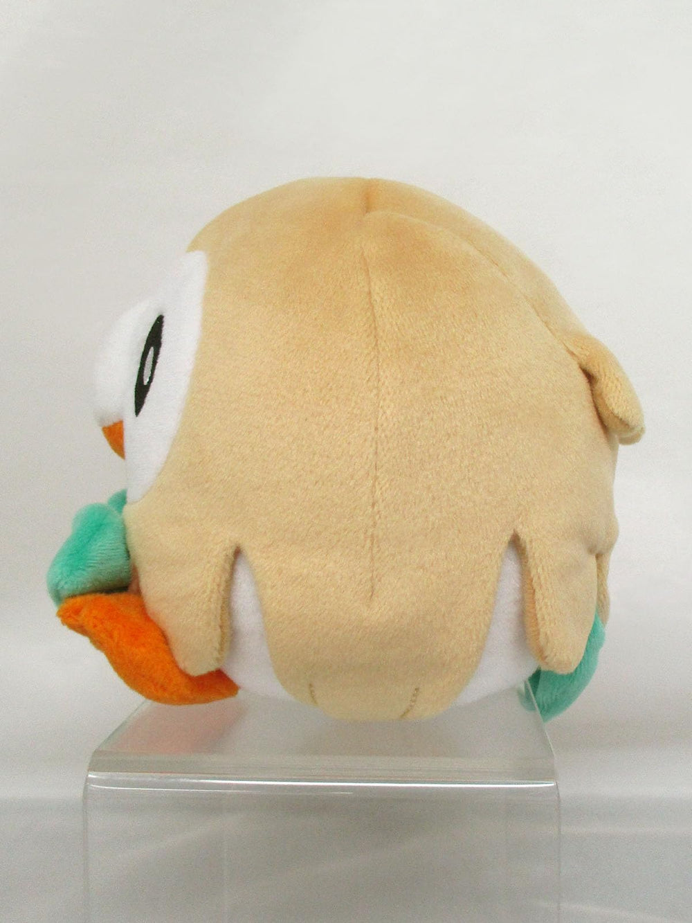 Sanei Rowlet plush side view, compact cuddle buddy