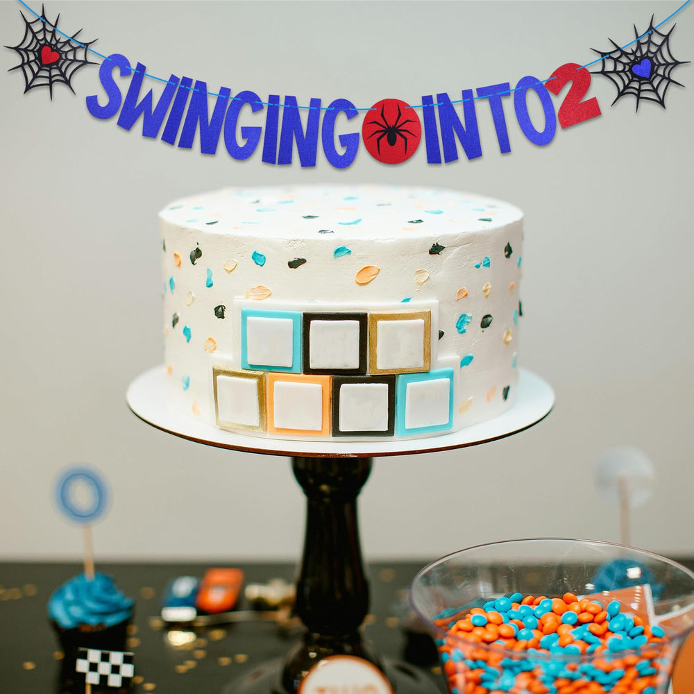 SAVITA banner used as dessert table backdrop with spider motif