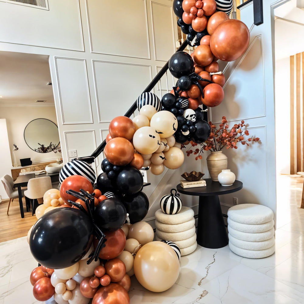 Saxuxu foil spiders and black-striped balloons add dramatic flair