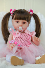 SCOM lifelike reborn doll girl hair styled for accessorizing.