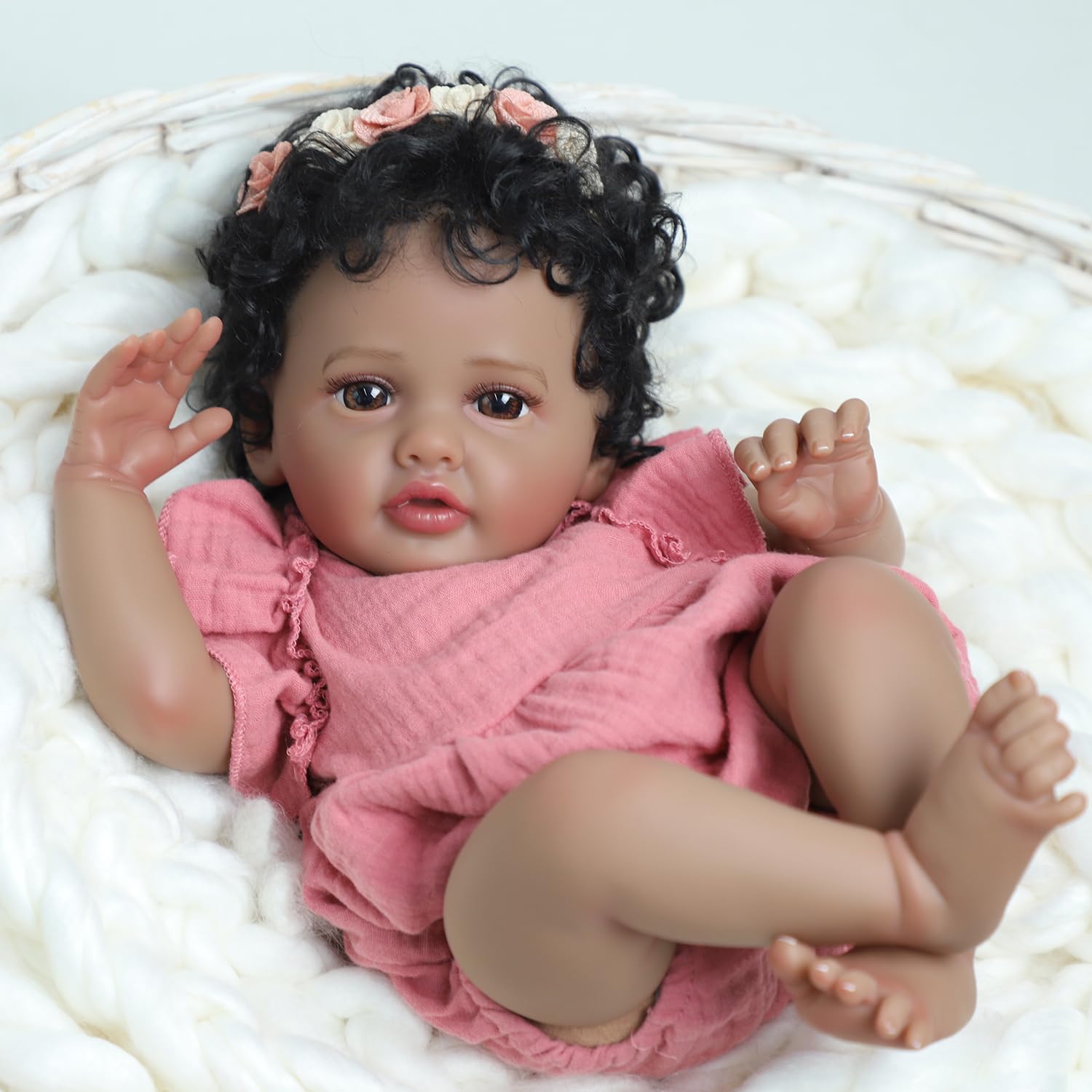 SCOM pink dress and flower headband add charming newborn-style aesthetics