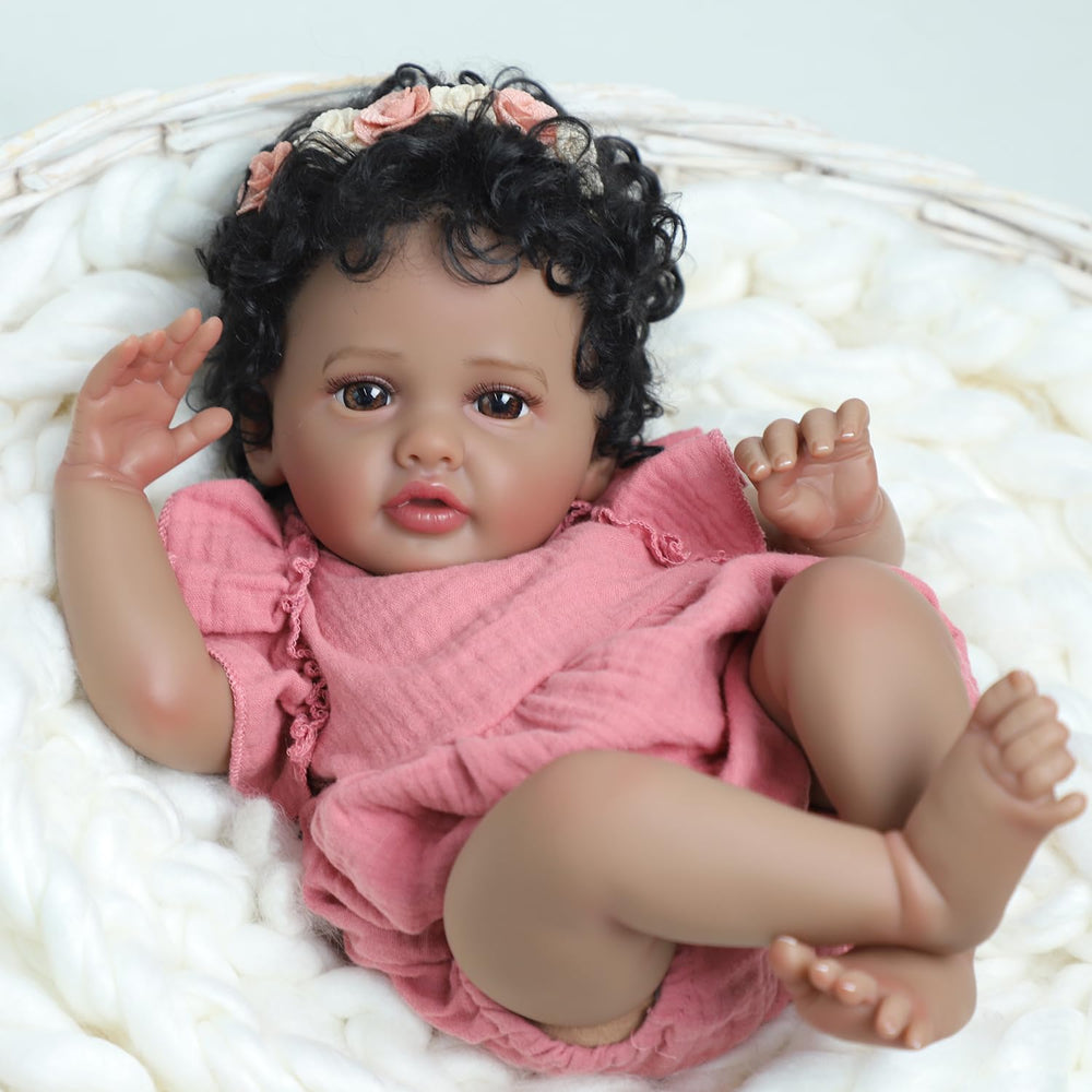 SCOM pink dress and flower headband add charming newborn-style aesthetics