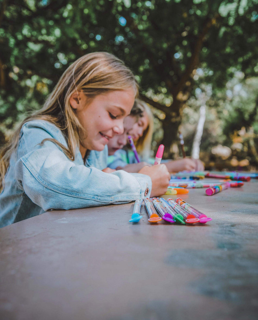 Two kids using Smencils in a classroom, promoting engagement and incentives
