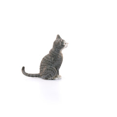 Schleich Farm World cat figurine placed in a farm scene to spark storytelling.