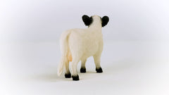 Schleich Farm World Galloway cow in a playtime scenario, sparking storytelling.