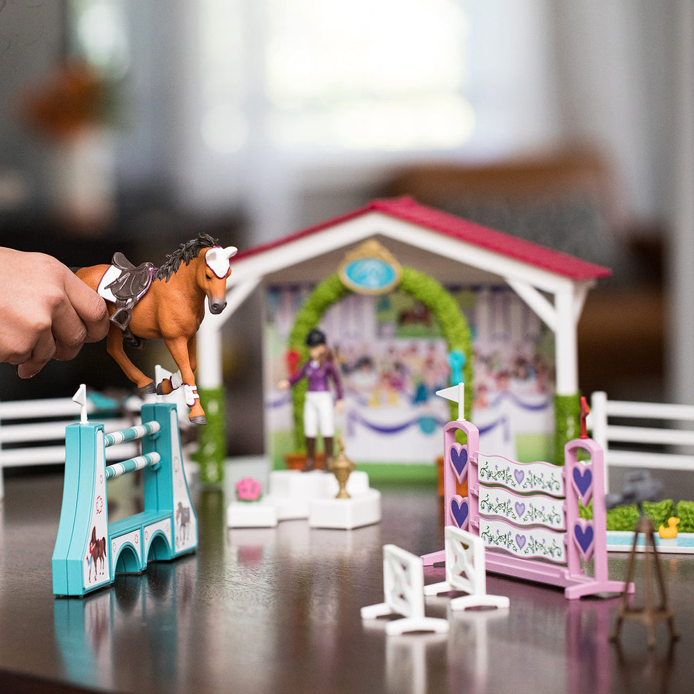 Schleich stable with accessories creates authentic barnside habitats for stories.