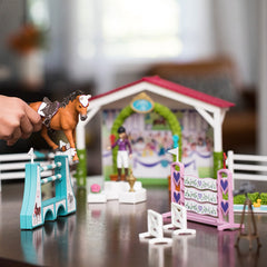 Schleich stable with accessories creates authentic barnside habitats for stories.
