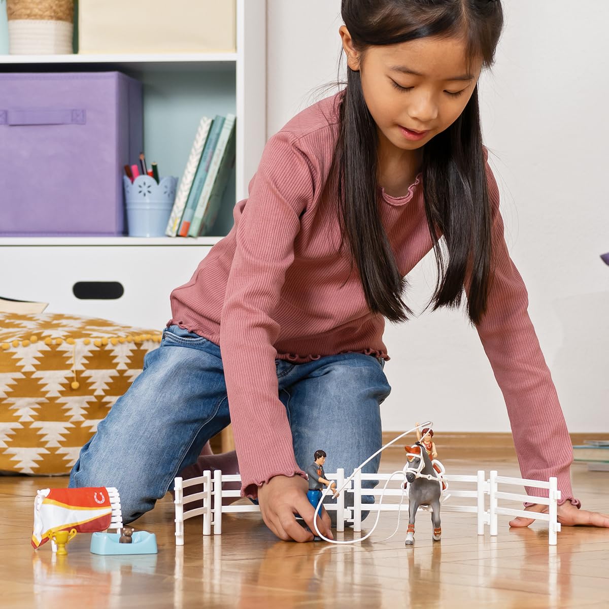 Stable and barn accessories from Schleich enhance home play scenes.
