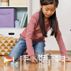 Stable and barn accessories from Schleich enhance home play scenes.