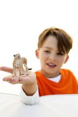 Closeup of Schleich Wild Life cheetah figurine showcasing detailed sculpting and pose.