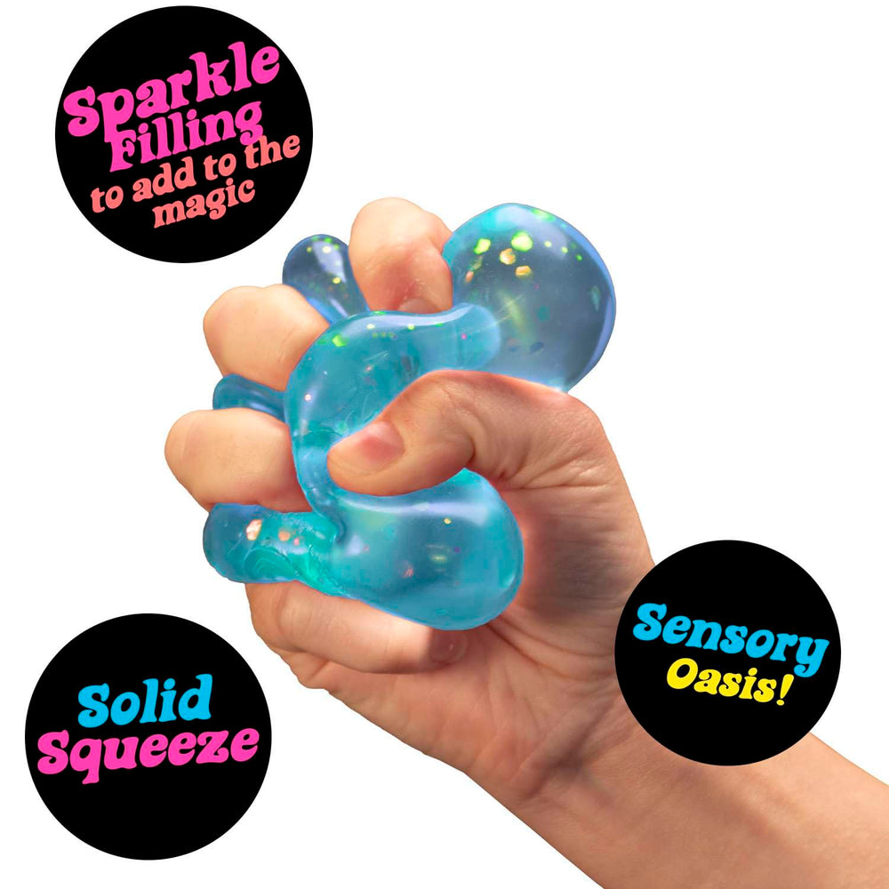 NeeDoh Dream Drop soft silicone squeeze demonstrates portable stress relief on the go.