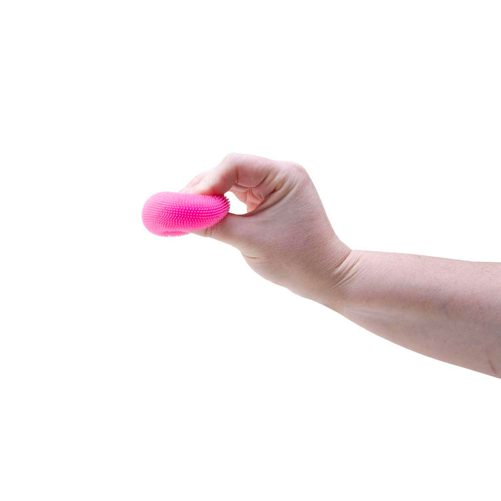 NeeDoh Teenie Fuzzball held in hand for portable, on-the-go use