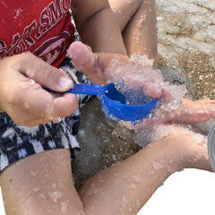 Science Gone Fun polymer absorbs liquid during spill demo for learning.