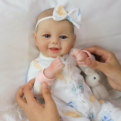 SCOM Baby Doll complete care kit includes pacifier, bib, diaper, and bottle.