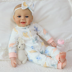 SCOM Baby Doll with realistic hand-sewn eyelashes for a lifelike look.