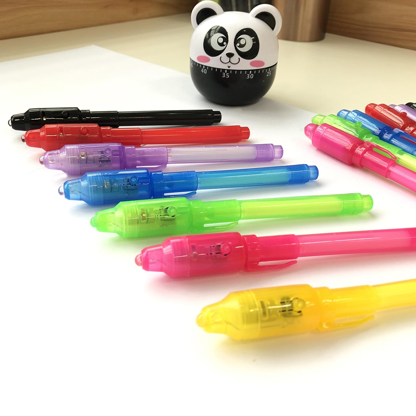 SCStyle UV ink pen glows on paper during classroom activities.