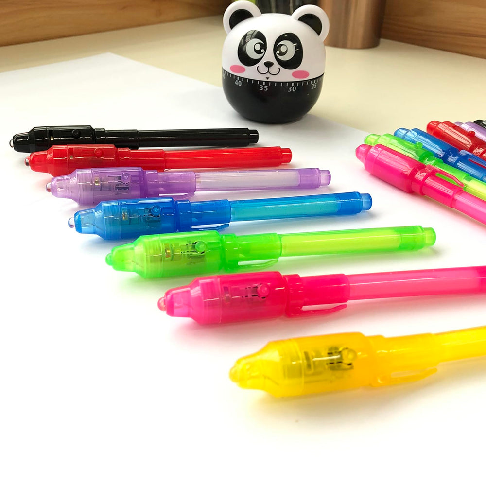 SCStyle UV ink pen glows on paper during classroom activities.