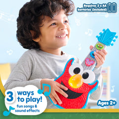 Elmo guitar toy, side view, buttons activate sounds and fun.