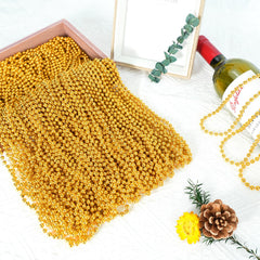 SHAOQINLIN gold Mardi Gras beads worn as a costume accessory for celebrations.
